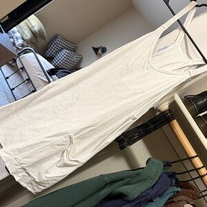 White casual dress with pockets and built in shorts